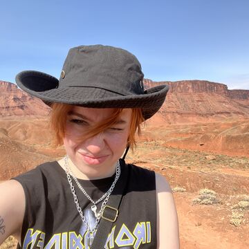 A selfie of a person standing outdoors