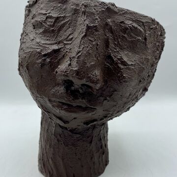 A ceramic sculpture of a head
