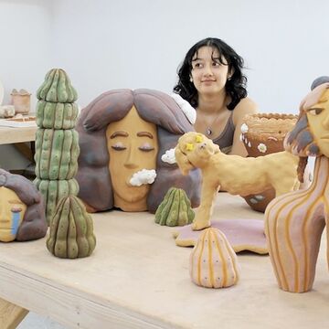 A collection of ceramic sculptures on a table 