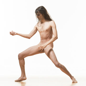 Kyriakos plays air guitar naked.