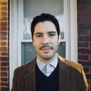 Portrait of a person standing outside