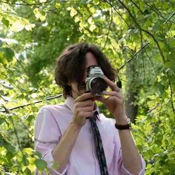 A headshot of SAIC writing center tutor Charlie Burke Dykstal