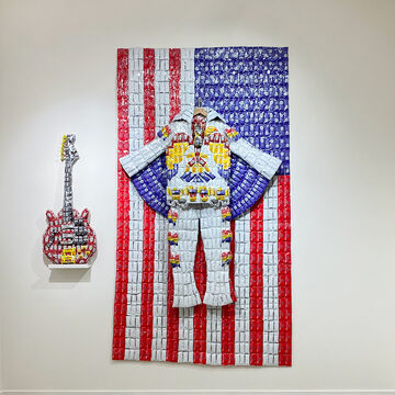 Two sculptures by Ethan Chan depicting a guitar and an American flag