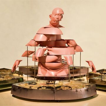 Sculpture by Hongwei Cao of a pink, fragmented figure.