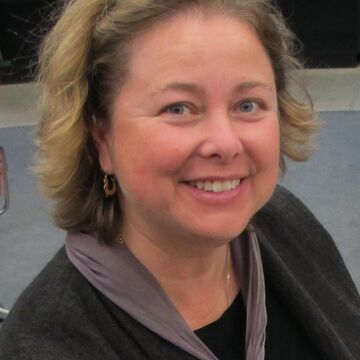 Anna Edlund, an SAIC faculty member and adult white woman, smiling outdoors.
