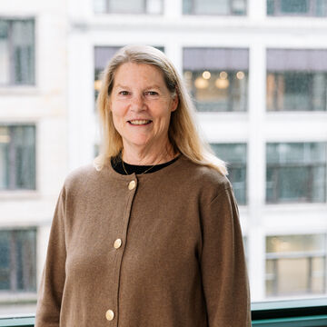 Portrait of Gretchen Talbot, an adult fair-skinned person with medium length blonde hair.