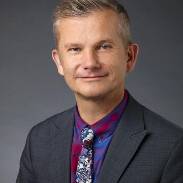 Headshot of Thorsten Lumbsch, a fair-skinned adult person with short-cropped blond hair.