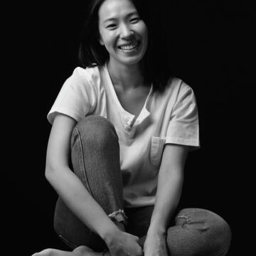 A black and white photograph of Jieun Jung smiling. 