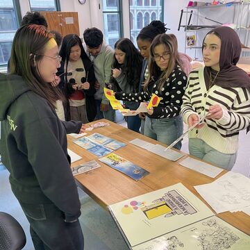 Students view and discss artwork.