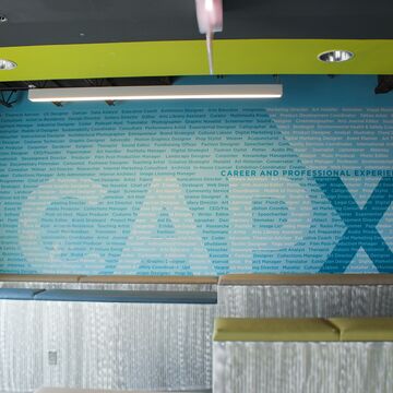 Blue wall that reads: "Career and Professional Experience; CAPX." 