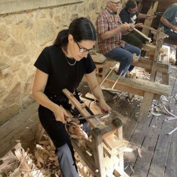 Lesley Jackson, an adult person with a fair skintone, woodworking. 
