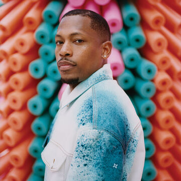 Germane Barnes against a colorful backdrop.