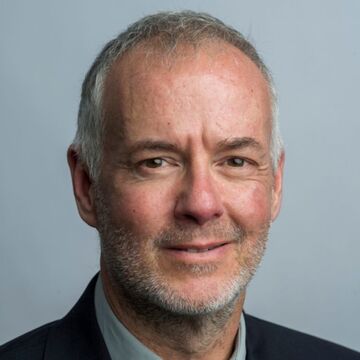 A close-up headshot of Rob Reddy