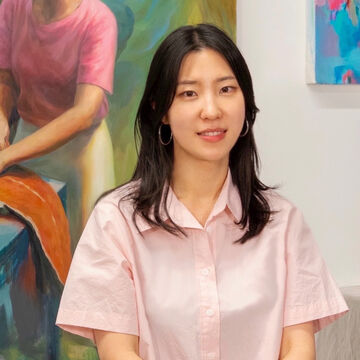Headshot of Janice Yang, an adult Korean American person with a medium-fair skintone and dark hair. 