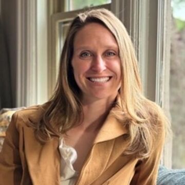 SAIC faculty member Mary Kettering, a person with blond hair and light skin tone, wearing a tan blazer.