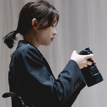 A person holding a camera.