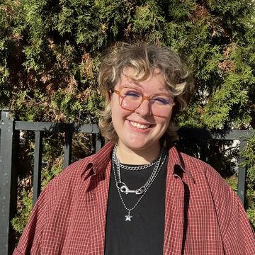 A photo of ceramics student Mal Gosett standing outside.
