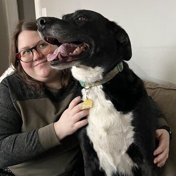 Headshot of Melody Miller and a Dog