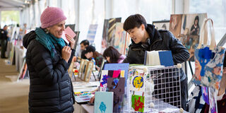 Student selling art 