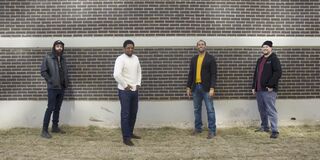 Image of people in front of a building.