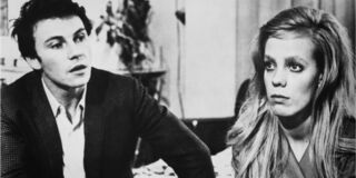 Black and white still of a white man and woman seated indoors from the film "Who's That Knocking at My Door."