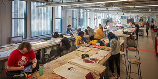 Students working on projects in SAIC's fiber studio