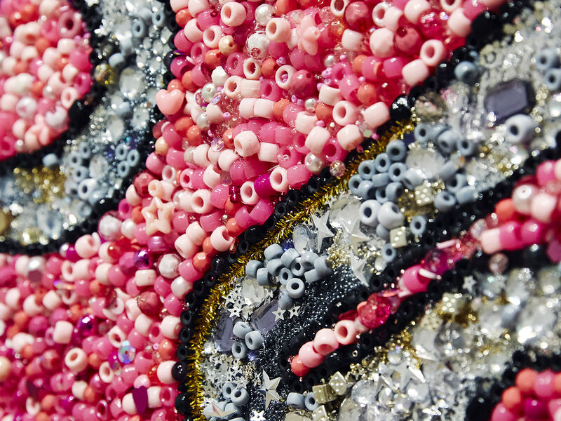 red, white, and black beaded art