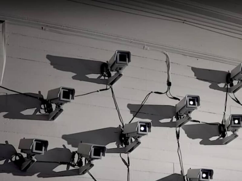 Image of multiple surveillance cameras affixed to the same wall