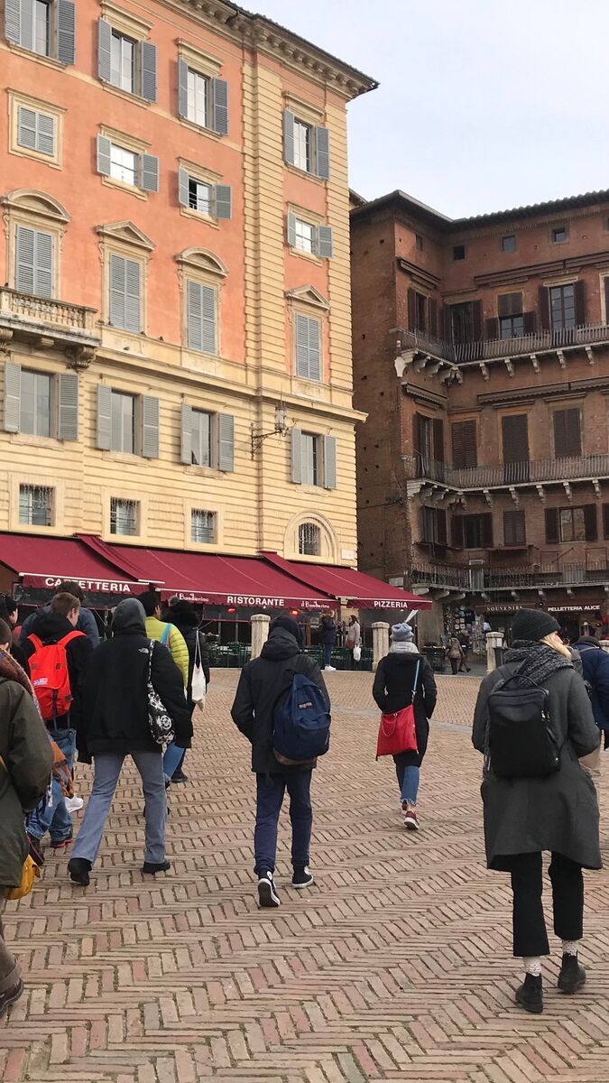 A large group of students walking in Siena, Italy. 