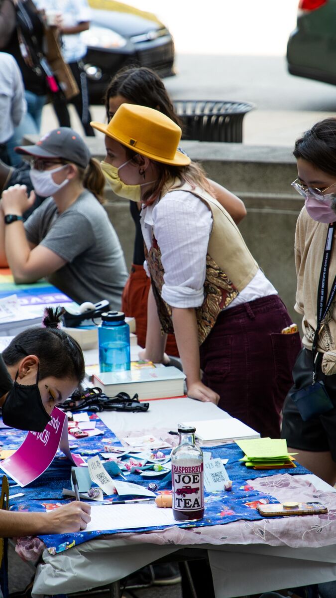 Students at outdoor tables.