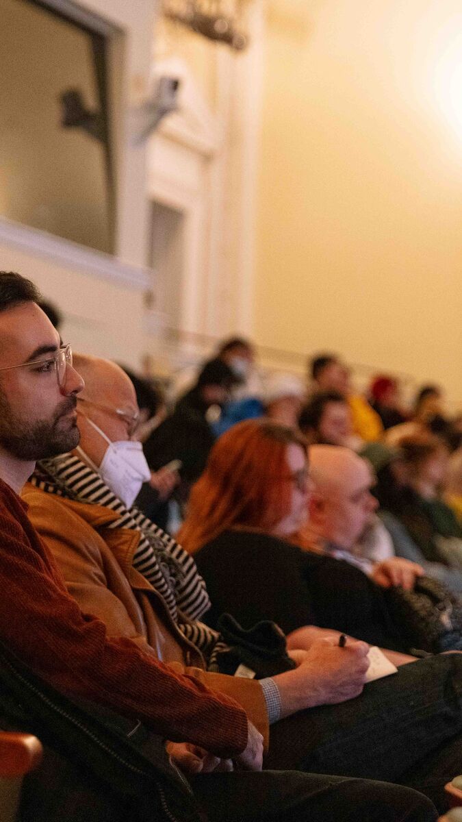 Audience listening to Whitaker Malem Lecture in the Art Institute of Chicago Fullerton Hall