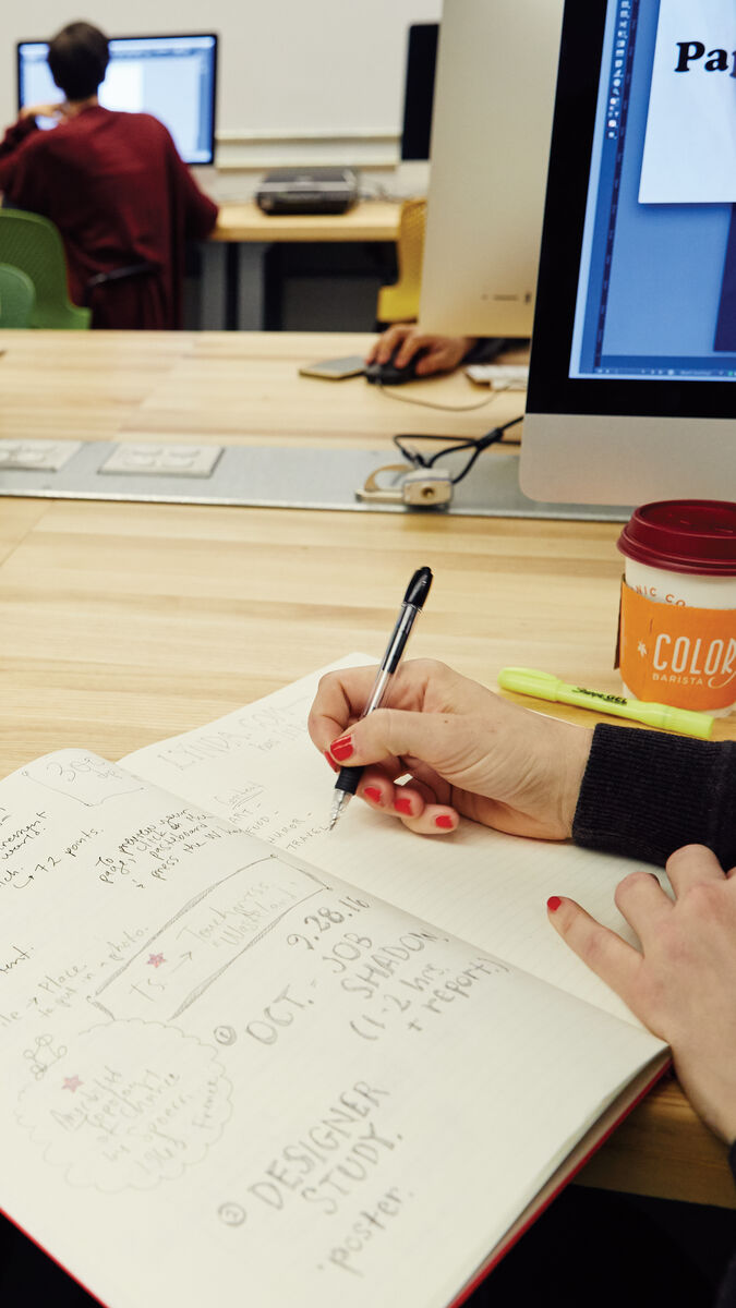 A student writing in a notebook