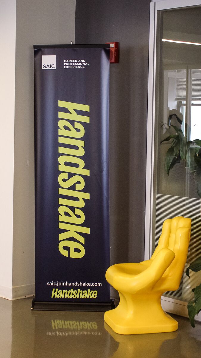 Handshake logo banner in the CAPX office. 
