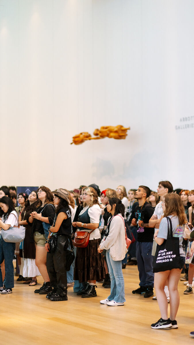 Students of varying ethnicities, ages, and genders gather in the Art Institute.