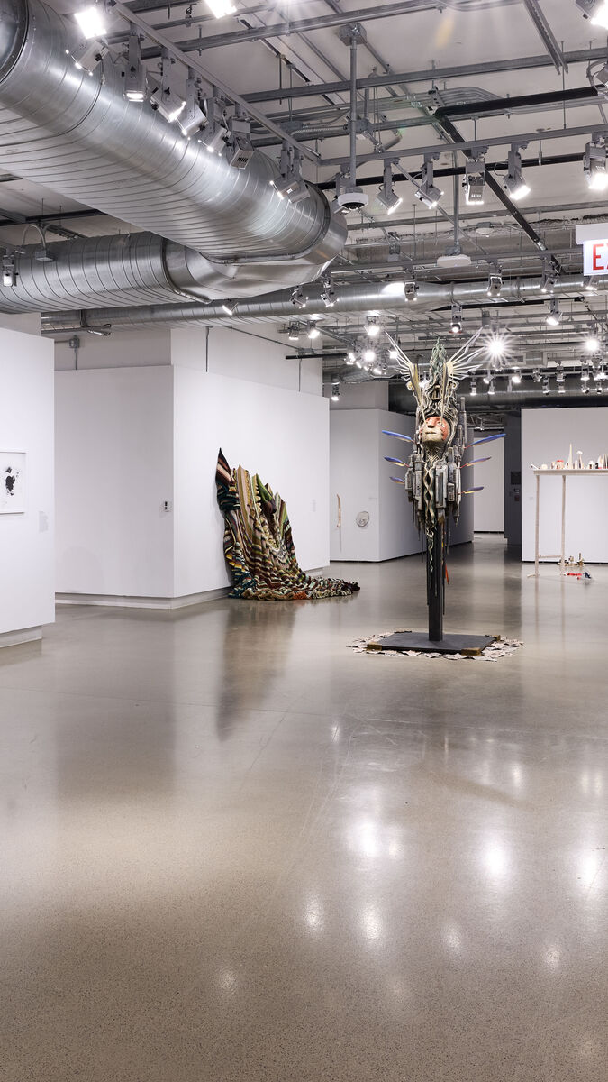People moving through an exhibition.