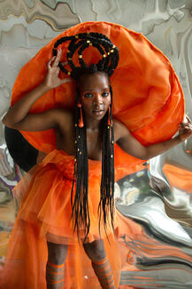 Person in an ornate orange outfit