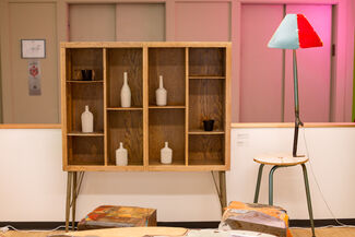 Wooden shelving and a chair with a lamp