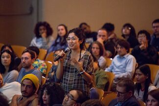 Audience member asking question.