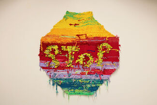 Colorfully woven stop sign by Danielle Lasker