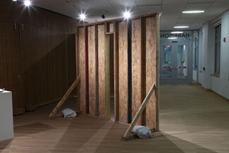 The back of a wooden wall displayed indoors