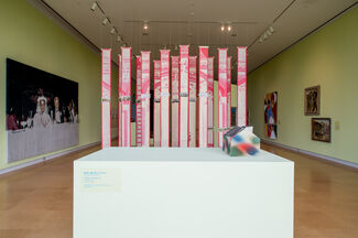 Installation by Thuong Tran of woven jacquard pieces suspended from the ceiling.