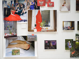 Various portraits and subjects photographed by Marzena Abrahamik displayed on a blank wall. 