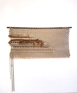 A beige rectangle of woven rope by Yasmin Spiro. 