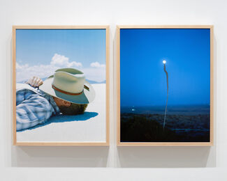 Two framed blue-dominant prints by James Baroz. 