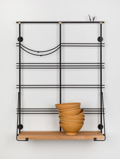 A sculptural installation including stoneware bowls and brass by Alex Chitty.