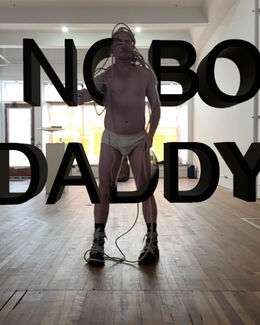 A person stands in front of a mirror that says "Nobo Daddy".