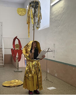 A person wearing a gold costume.