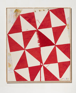 A painting hanging on a wall with red and white geometric shapes.