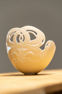 A carved eggshell by Emily Miller. 