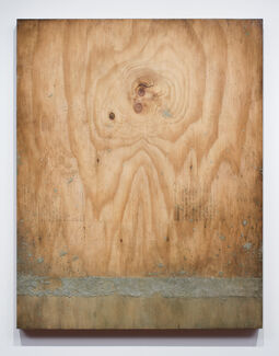 Faint black lines and a textured gray bar painted on a block of wood. 